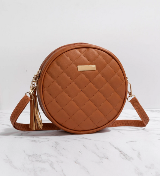 quilted mini circular bag with fringe & metal design